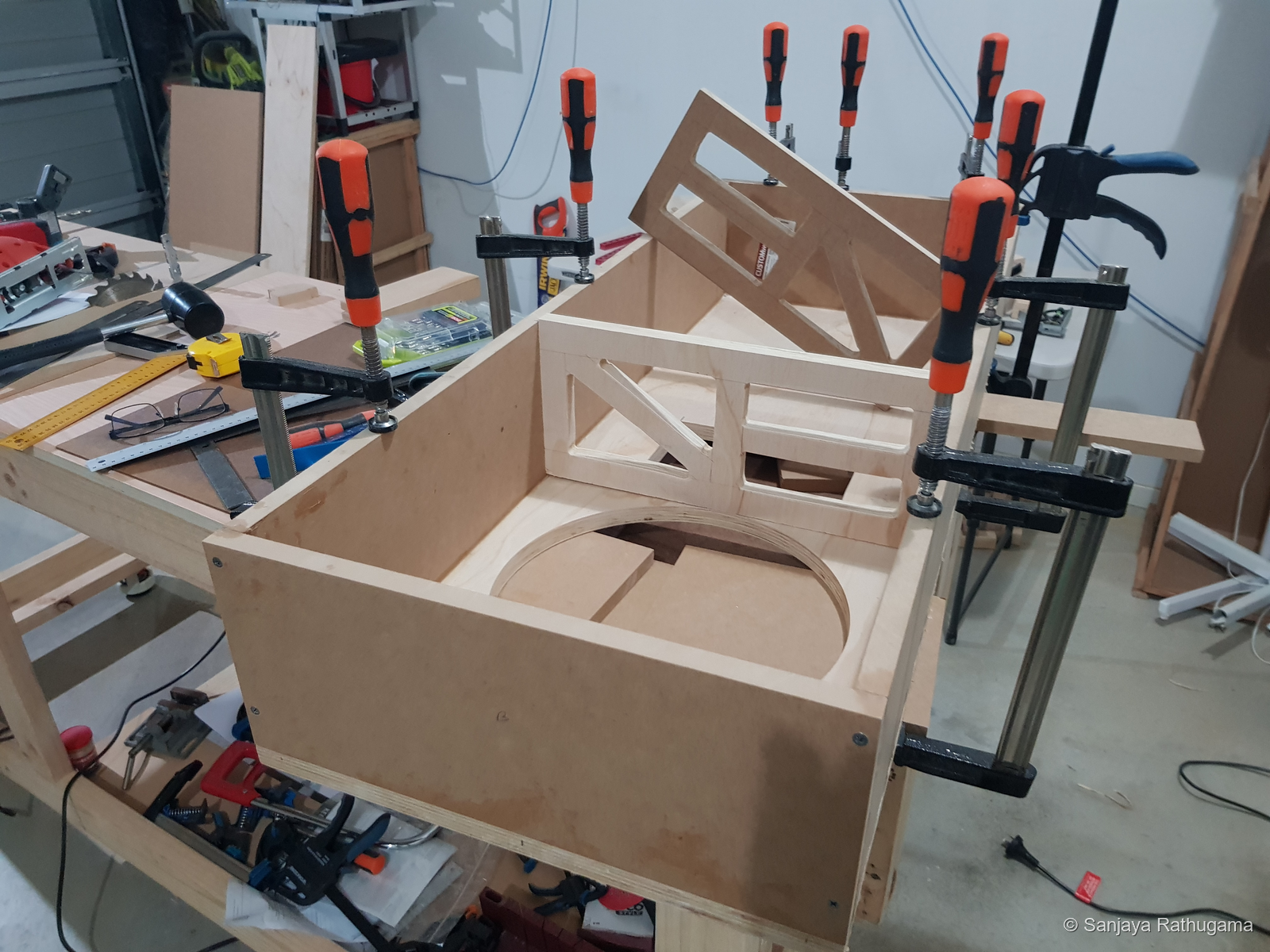 Plywood window bracing within the shallow enclosure during assembly