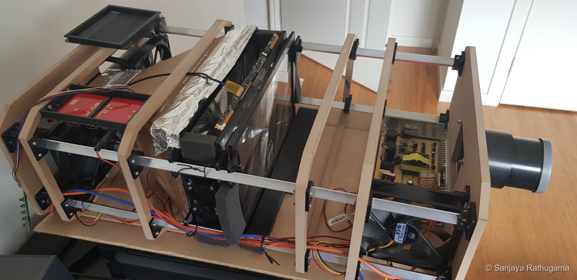 Open-frame view showing the LCD fan bank and larger cooling fans
