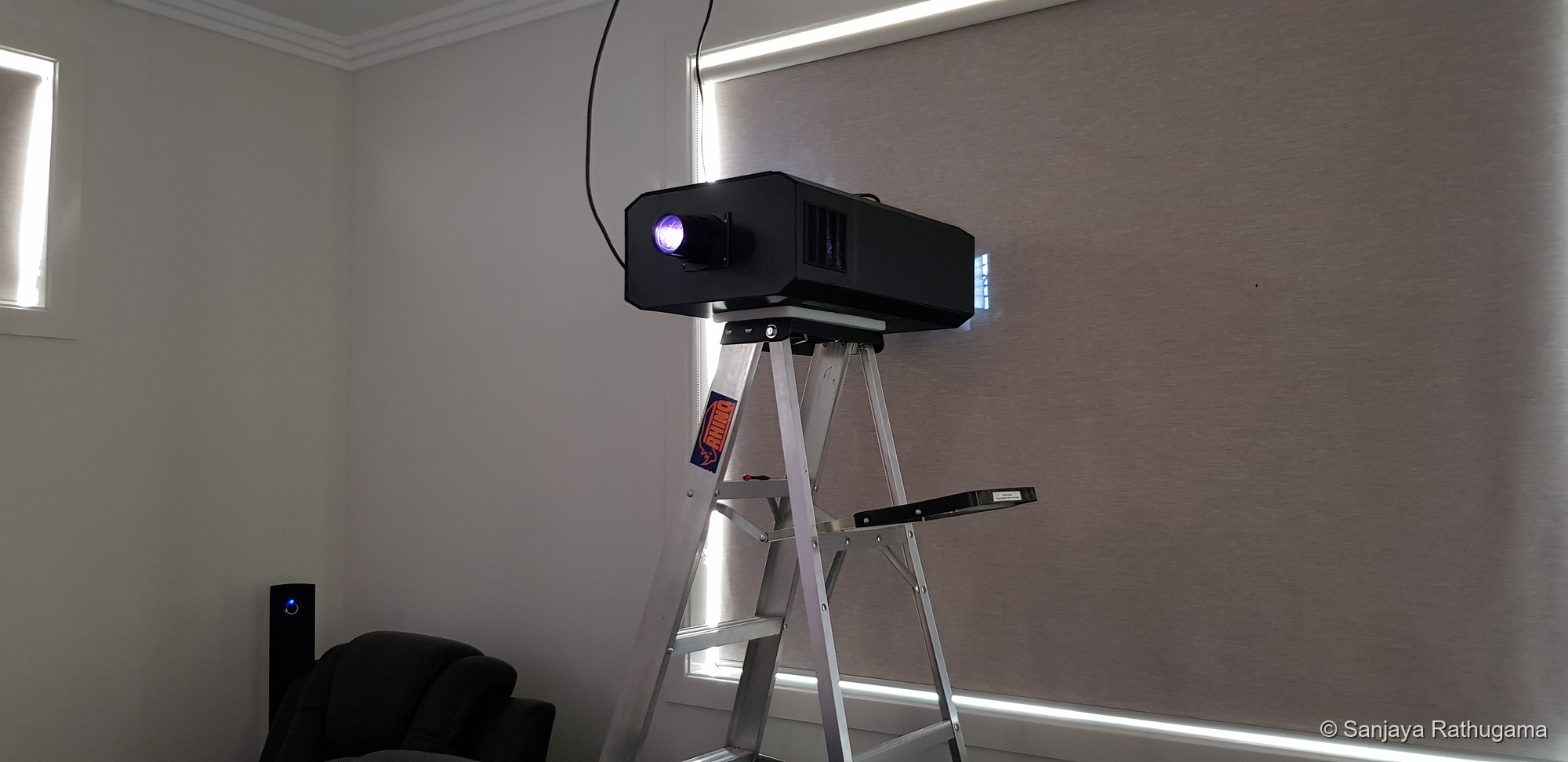 Projector testing on a ladder