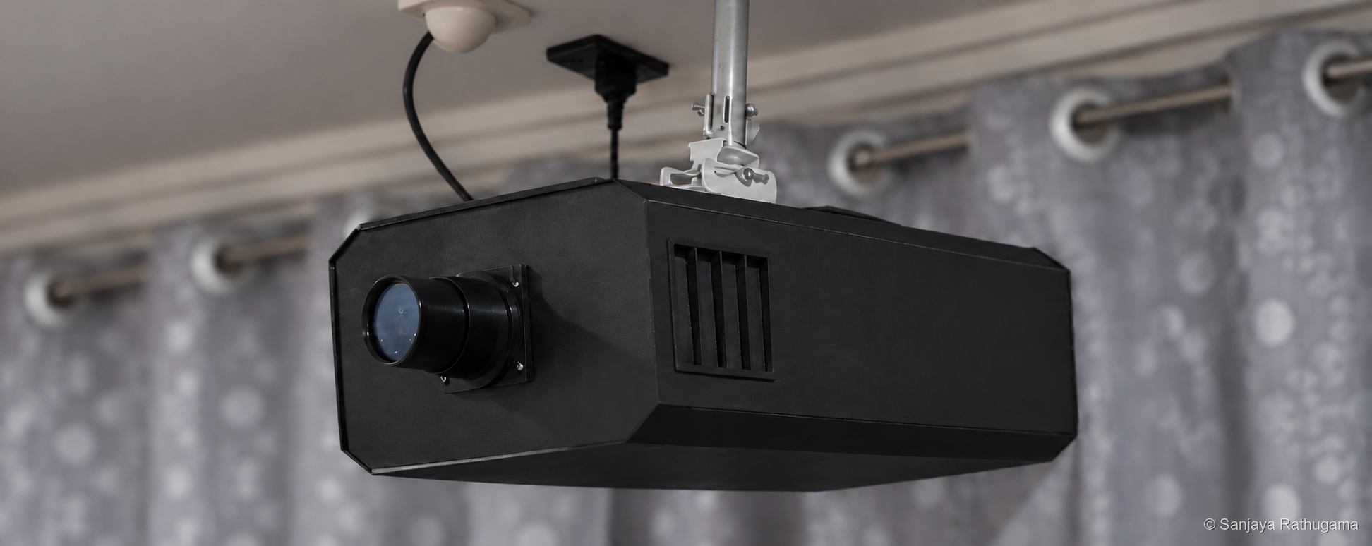 Adapted cover showing the completed projector against its softly blurred grey patterned curtains